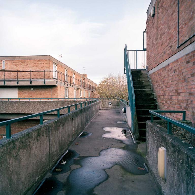 The aerial walkway between Thompson and Norman Butler Houses, with the Norman Butler fire escape staircase on the right of the image. Photo by Kevin Percival, a resident of Pepler House, 2019.